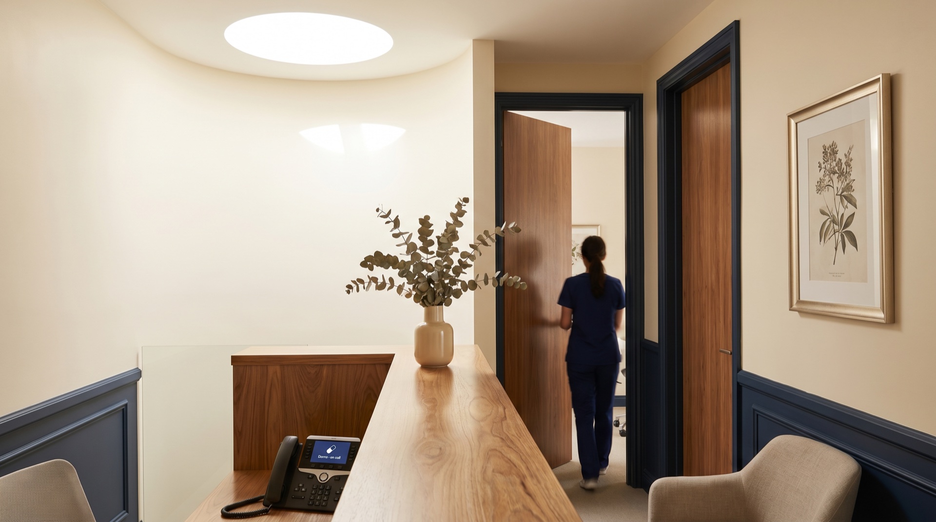 Clinic front desk handing off calls to Della AI receptionist
